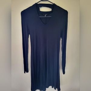 Black short express dress. NEW. The front opens up. Long sleeve